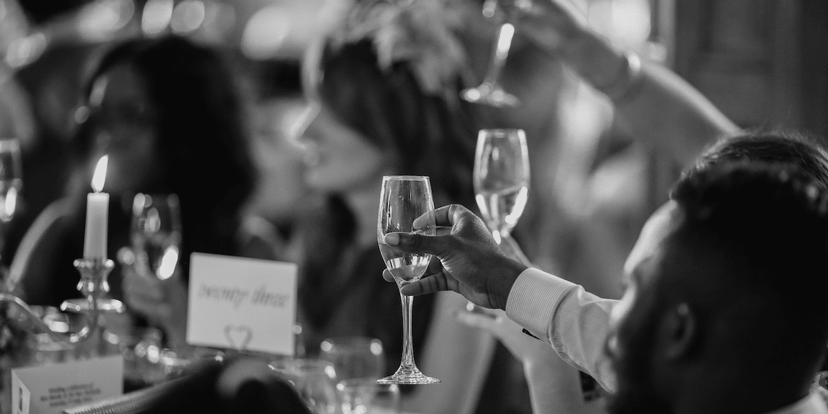 Image commercially licensed from https://unsplash.com/photos/grayscale-photo-of-people-rising-a-drinking-glasses-K8V2NDNJDYo